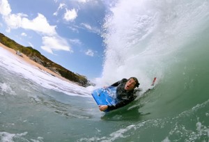 Bodysurfing the giant waves, Cornwall