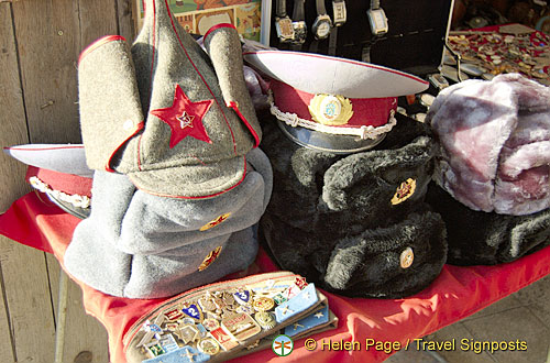 Various Russian hats and medals for sale
