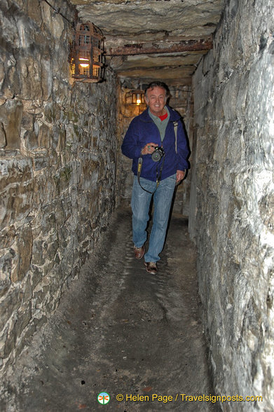 Very narrow dungeon corridor