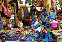 This stall offers colorful woollen beenies, scarfs and matching bags