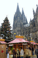Cologne Weihnachtsmarkt set against the cathedral and its Christmas tree