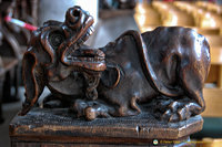 Carving of mythical creature on choir stalls
