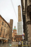 View of Bologna's two towers - Garisenda and Asinelli. The taller Asinelli Tower is being restored