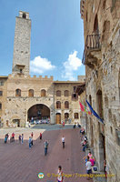 The old Palazzo del Podestà with the very tall Torre Rognosa on Piazza Duomo