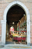 View of seafood market through an entrance arch