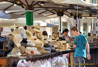Hats and t-shirts at the Piazza Erbe market