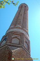The fluted minaret's red bricks were once decorated with turquoise tiles