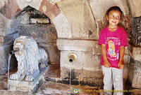 Beautiful Turkish girl posing by the Lion Fountain