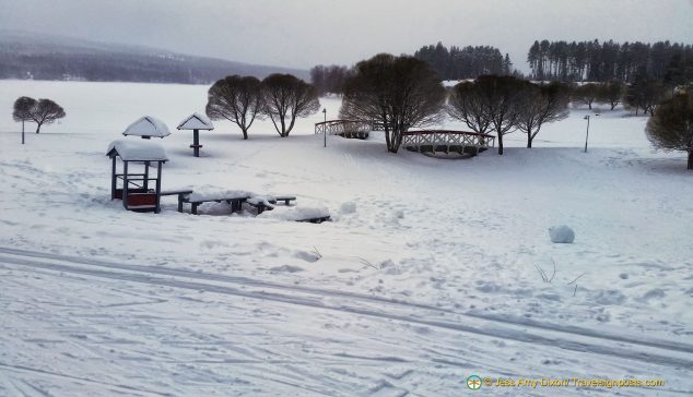 Snowmobile across the middle of the frozen Jäätiönlampi lake