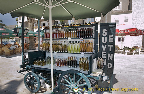 Colourful bottles of travarica - Croatian grappa