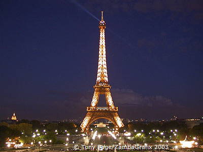 The Eiffel Tower sparkles by night