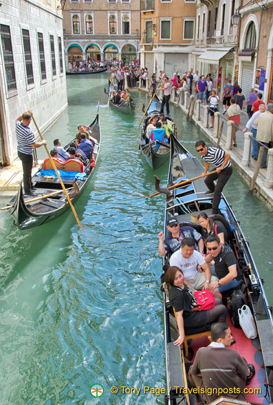 The gondola business goes on as long as the boats are able to make it under the bridges