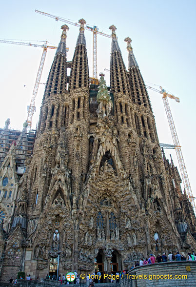 Sagrada Familia's east-facing Nativity Facade consists of four  towers and three doorways.