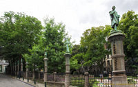 The Petit Sablon Garden is enclosed by a wrought iron fence decorated with statues