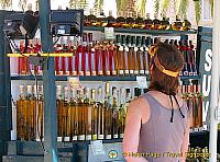 Colourful bottles of travarica - a herbal rakia or grappa