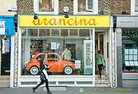 A cute orange car to advertise that Arancina is sold here
