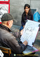Place du Tertre is known for its artists who paint tourists like this woman