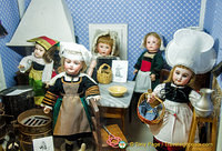 Dolls in kitchen costumes