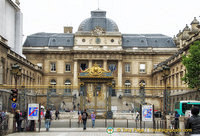 Entrance to the Palais de Justice. The front gate still carries the emblems of royalty.