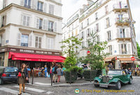 Brasseries, cafes, and bars on the junction of rue Yvonne le Tac, rue des 3 Freres and rue Tardieu