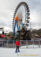 Ferris wheel and Ice World at the Neptune fountain