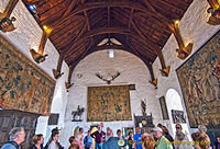 The walls of the Great Hall covered with tapestries