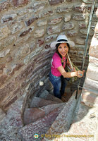 Squeezing my way down the spiral staircase of La Rocca