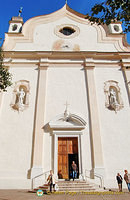 Statues of Saints Filippo and Giacomo adorn the plain facade of the parish church of Cortina d'Ampezzo