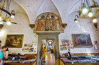 The Medicis donated the dormitory wing of the monastery to the Franciscans, hence the Medici coat of arms over the doorway