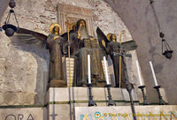 St Benedict prays between angels as he feels they are in his presence
