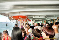 Riding the very crowded vaporetto to Burano
