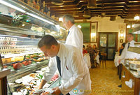 Waiters selecting seafood for orders