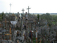 The hillock is covered by thousands of crosses