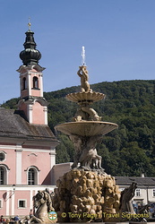 Baroque Residence fountain with St. Michael's Church in the background