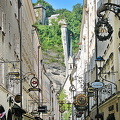 Getreidegasse - a charming narrow shopping strip decorated with wrought iron guild signs 