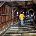 The covered passageway protects villagers making their way to the church