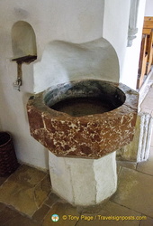 Holy water stoup in Weissenkirchen white church