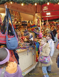 Cologne Weihnachtsmarkt stall selling colorful soft bags