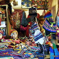 This stall offers colorful woollen beenies, scarfs and matching bags