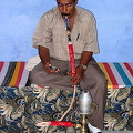 Smoking a water pipe.

Aswan - Nile River - Egypt