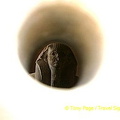 Statue of King Djoser viewed through a peephole.
[Step Pyramid of Djoser - Saqqara - Egypt]