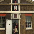 Astride the Prime Meridian, under the Millennium Clock 