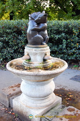 A hugging bear drinking fountain