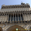 Two rows of pencil-thin columns on facade of Dijon Notre Dame