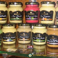Colourful jars of Dijon Mustard