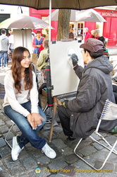 One of the many artists at work in Place du Tertre
