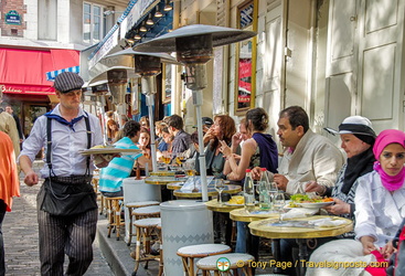 A waiter in artist's gear, at Place du Tertre