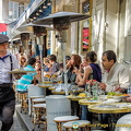 A waiter in artist's gear, at Place du Tertre