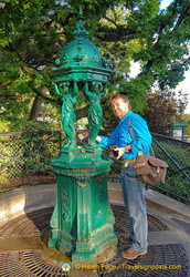 Tony has a drink from the Wallace fountain