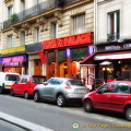 The bright neon signs along Boulevard de Clichy
